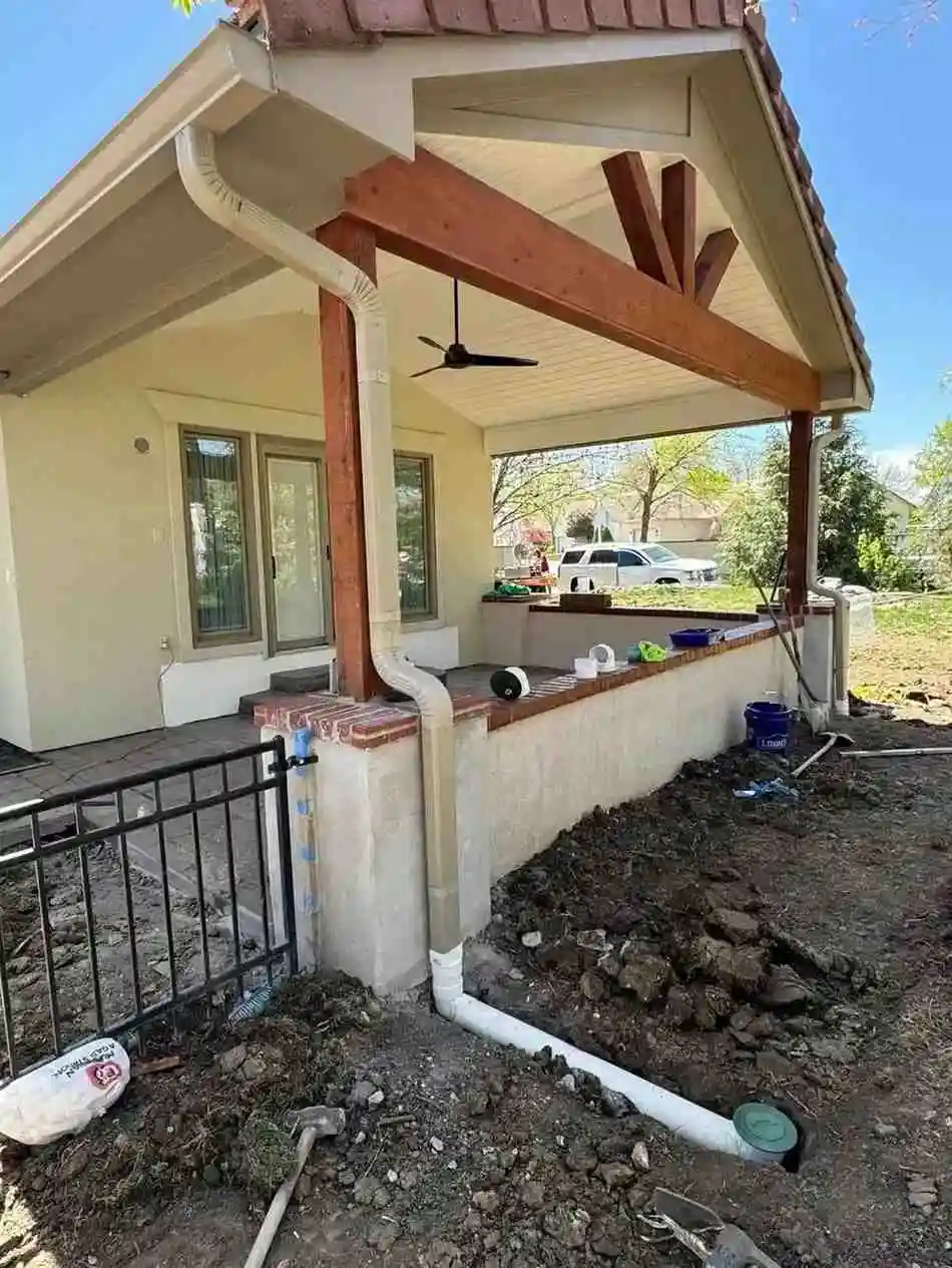 Downspout installed to direct roof water away from a building